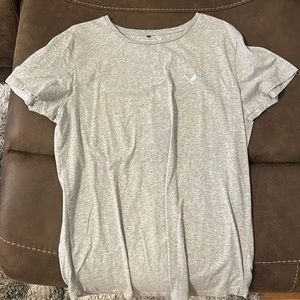 Grey Distorted people shirt size Large. Never worn